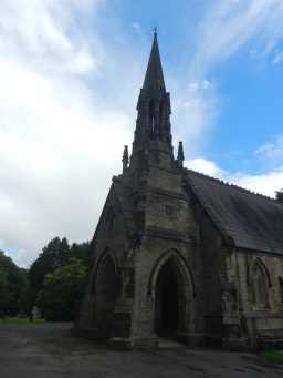 Oblique view of west porch and spire of Bishop Auckland Cemetery Chapel July 2016